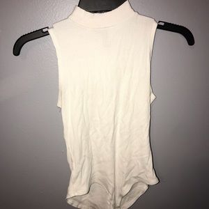 white mock turtleneck bodysuit